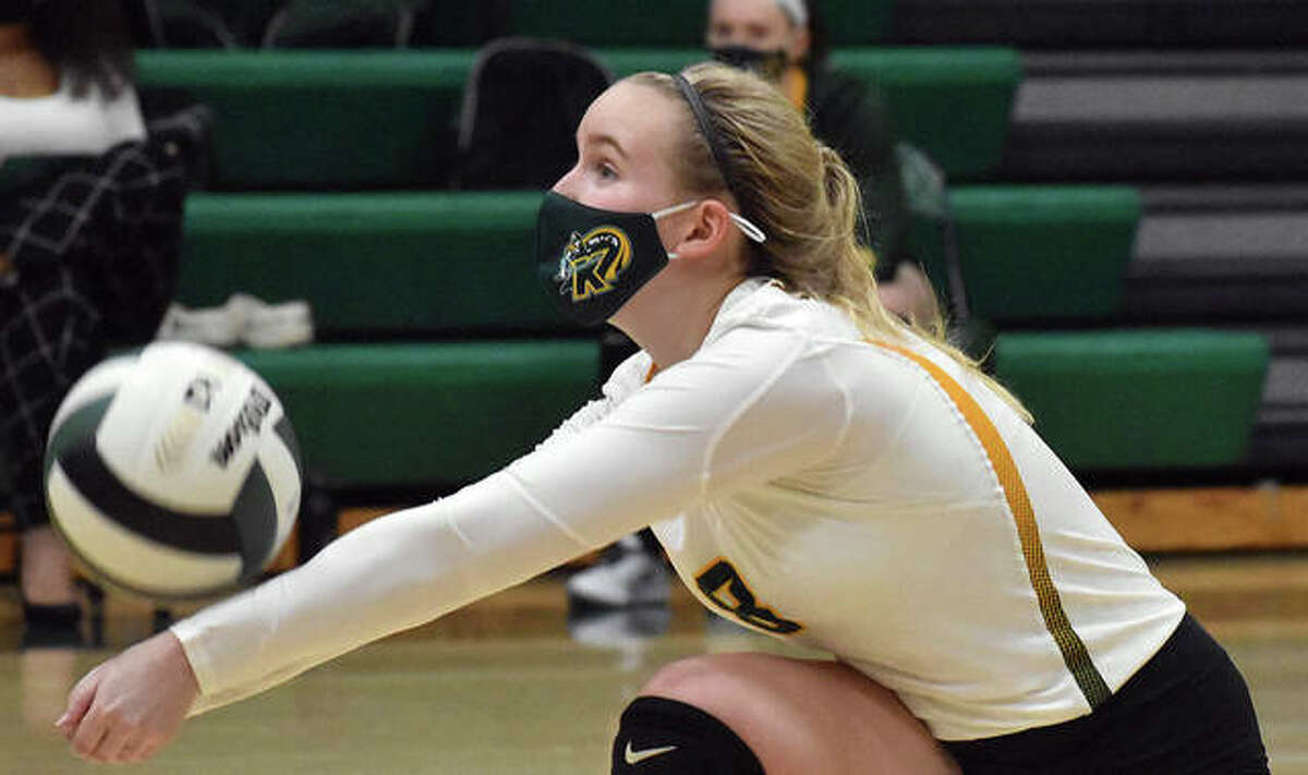 Metro-East Lutheran’s Chloe Langendorf makes one of her team-high 27 digs on Tuesday against Granite City.