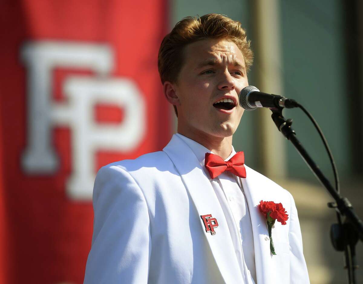 Graduate David Spellane performs the National Anthem at the Fairfield Prep graduation in Fairfield on Sunday.