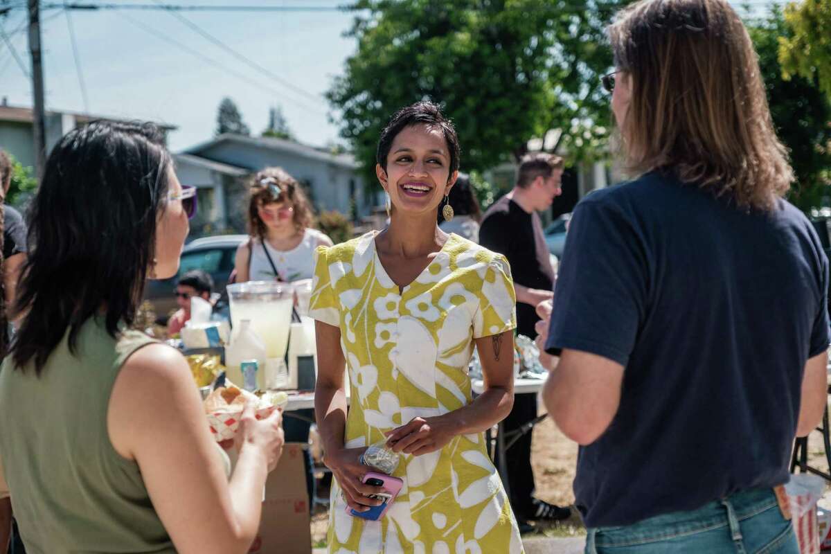 Janani Ramachandran, a social justice attorney, speaks with people at a backyard meet-and-greet barbecue with voters and volunteers in Oakland on Saturday, June 5, 2021. Ramachandran is one of the leading candidates running for a vacant state Assembly seat in the East Bay.