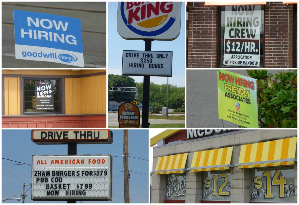 Business along U.S. 31 in Manistee display signs advertising unfilled jobs.