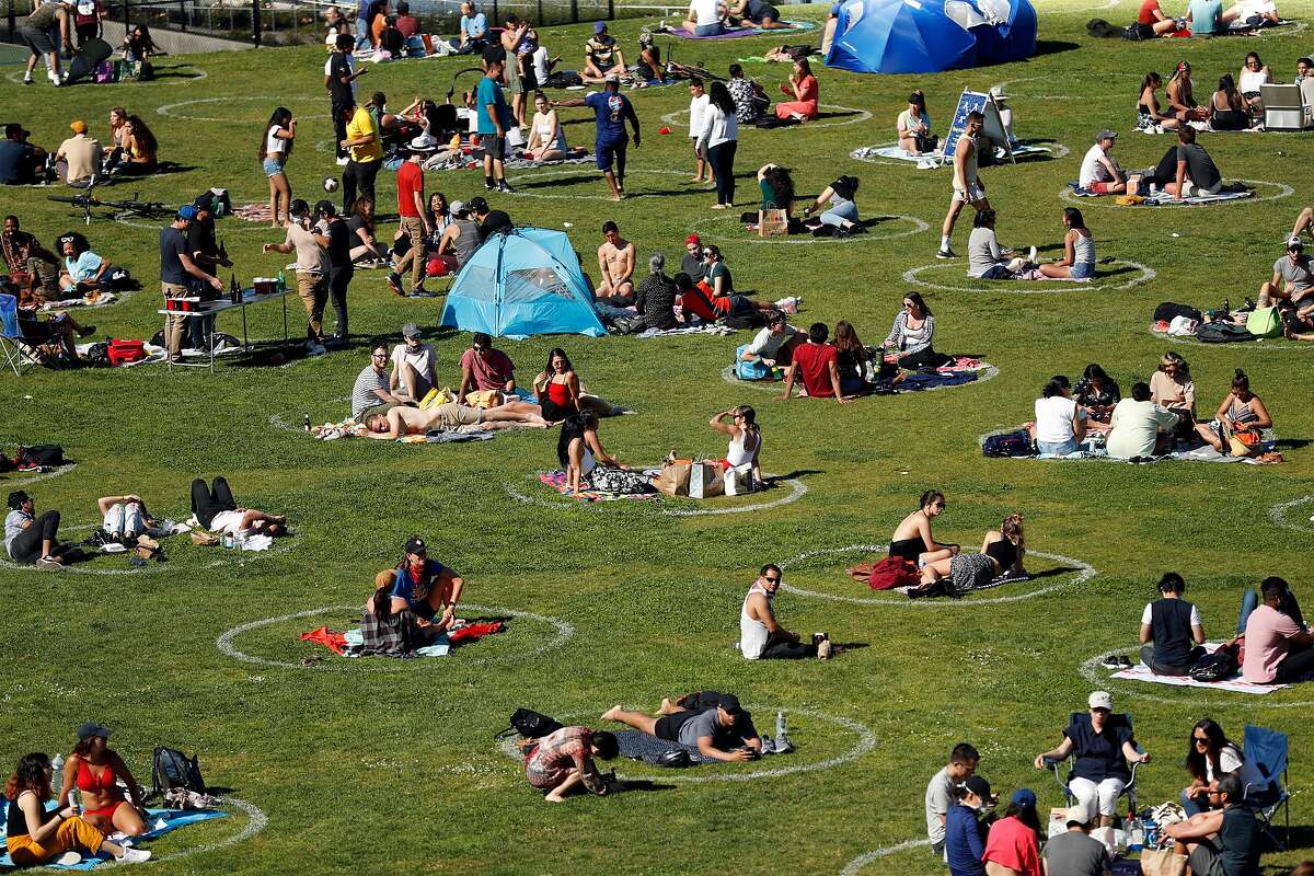 People socialize at Mission Dolores Park on May 24, 2020.