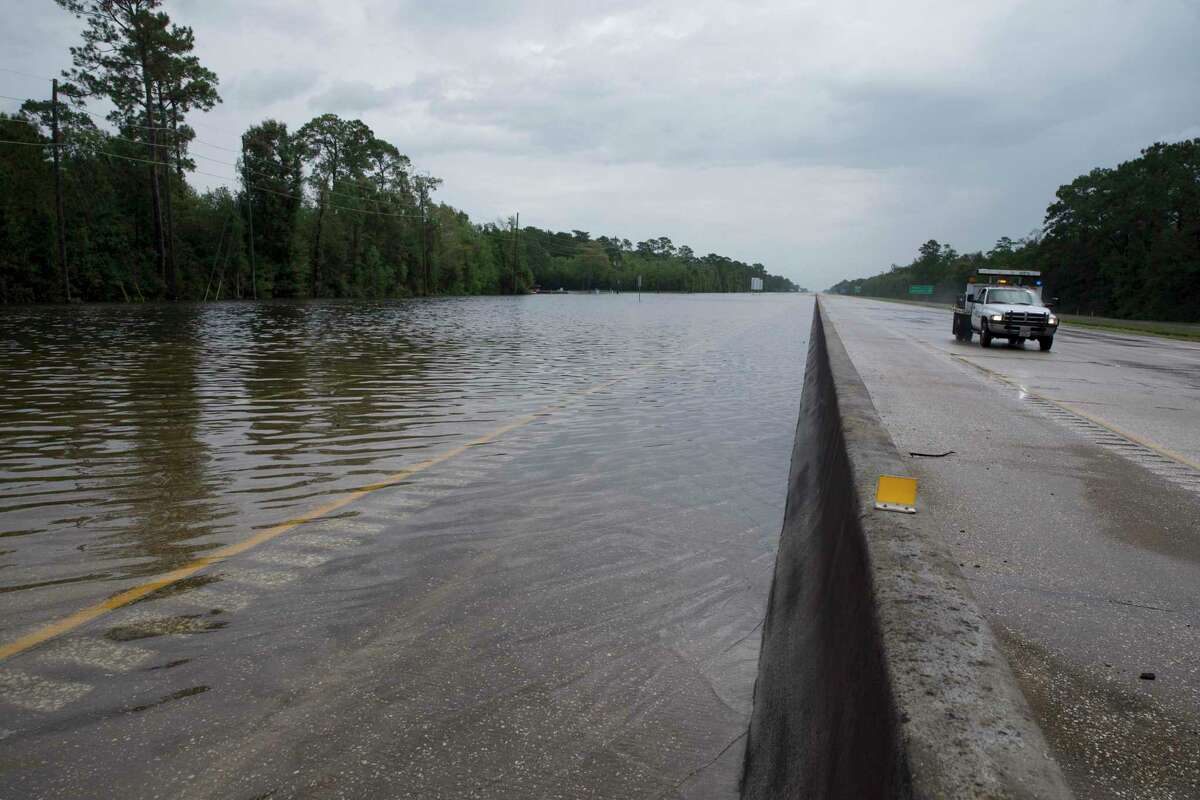 Floodwater from Tropical Depression Imelda pools on the westbound lanes of Interstate 10 on Sept. 20, 2019, in Winnie. Local landowners believe the median along the freeway acts as a dam, affecting their properties in heavy rains.