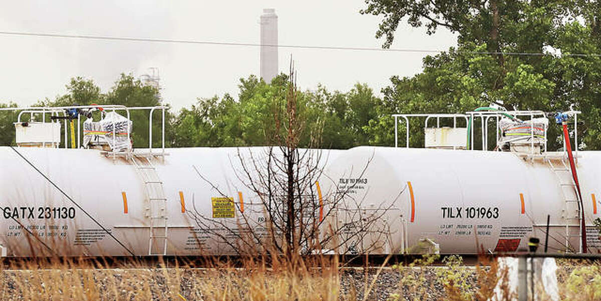 Two of the four railroad cars located about halfway between Wood River and Hartdford were sealed in plastic Tuesday morning as part of a containment system now in place. Late Tuesday night officials reported the other two railcars also had been sealed, and all four had been safely moved back to the Phillips 66 refinery.