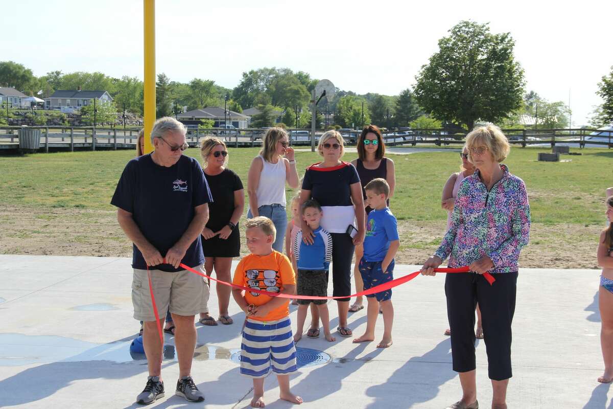 Port Austin residents spent Friday evening in the sun as the new splash pad opened for use. The pad at Bird Creek Park has been in the works five years as is dedicated to the memory of Shari Babcock Etzel. 