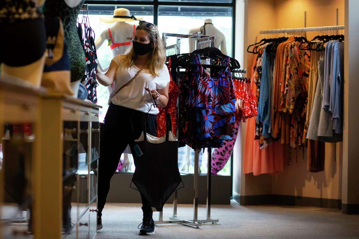 Caroline Jacobs browses swimsuits during her lunch break at Top Drawer Lingerie, a store in Uptown Park, on Thursday, June 3, 2021.
