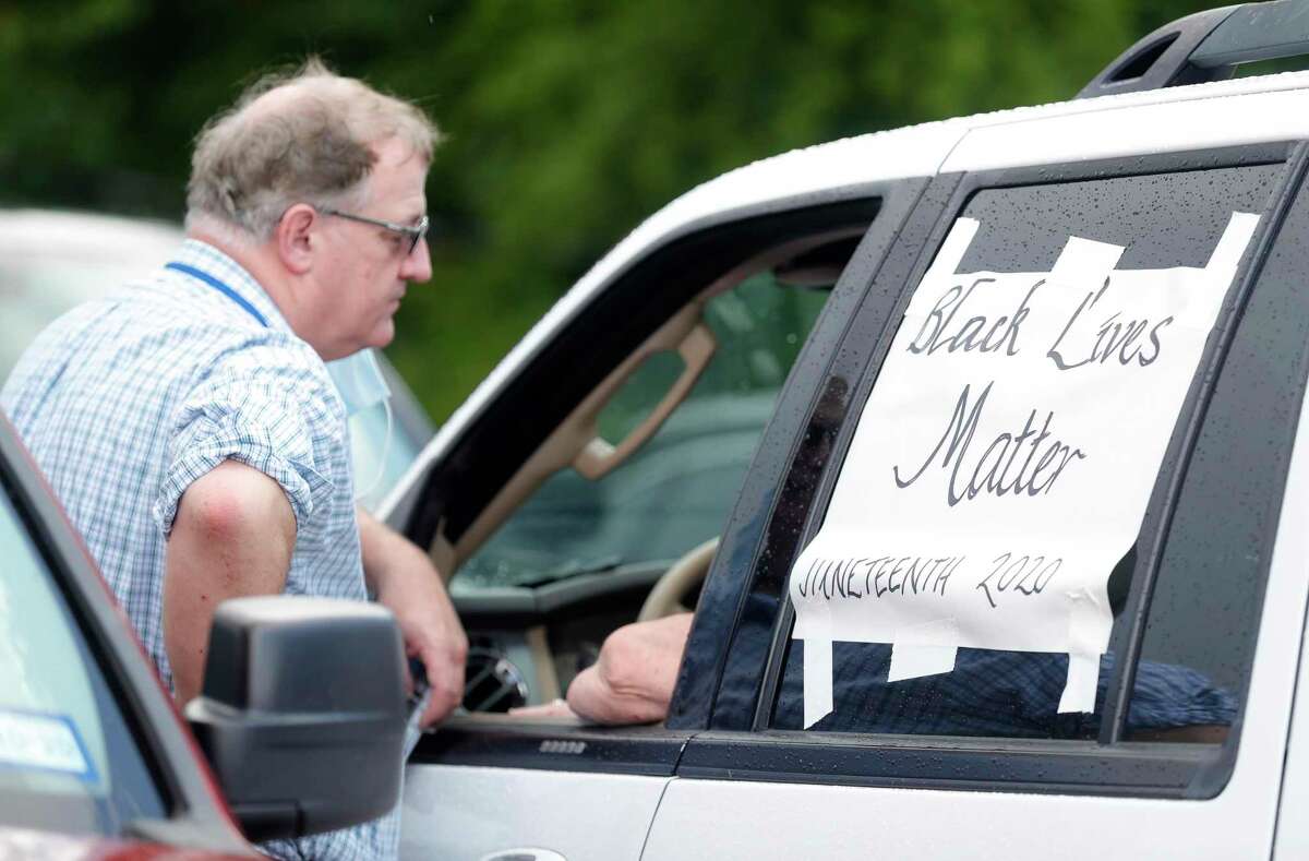 A Black Lives Matter sign is seen on a woman’s vehicle during Good Brothers & Sisters of Montgomery County’s inaugural Juneteenth celebration at Martin Luther King, Jr. Park, Friday, June 19, 2020, in Conroe. Juneteenth celebrates when Union General Gordon Granger read the federal orders that freed previously enslaved people in Texas in 1865, two years after President Abraham Lincoln signed the Emancipation Proclamation.