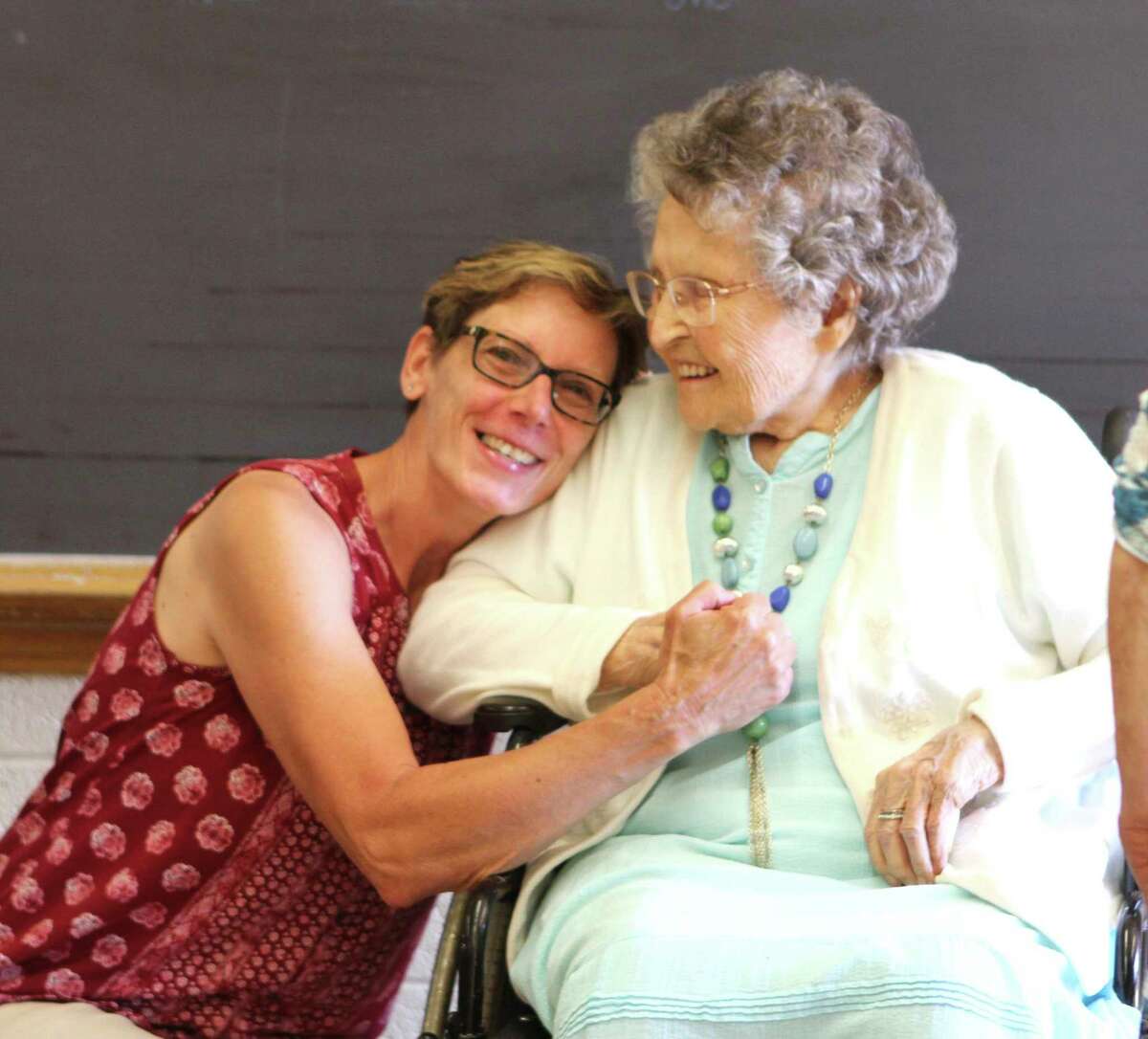 At 101 years young, Doris Drake (right) receives a memorable hug from one of her former students. Drake was once a teacher at Barryton Elementary School and attended the final walkthrough of the building on June 5. (Pioneer photo/Gena Harris)