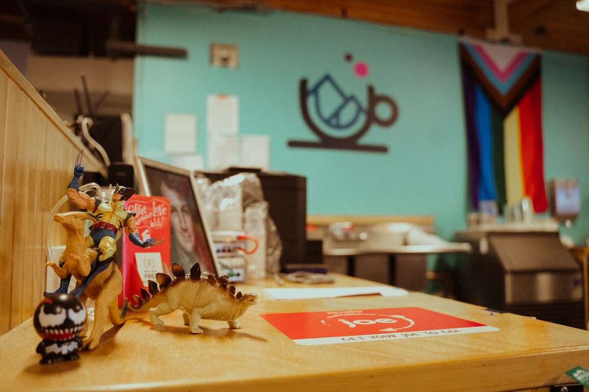 A view of dinosaurs on the table uploaded to their Yelp page by Distant Worlds Coffeehouse.