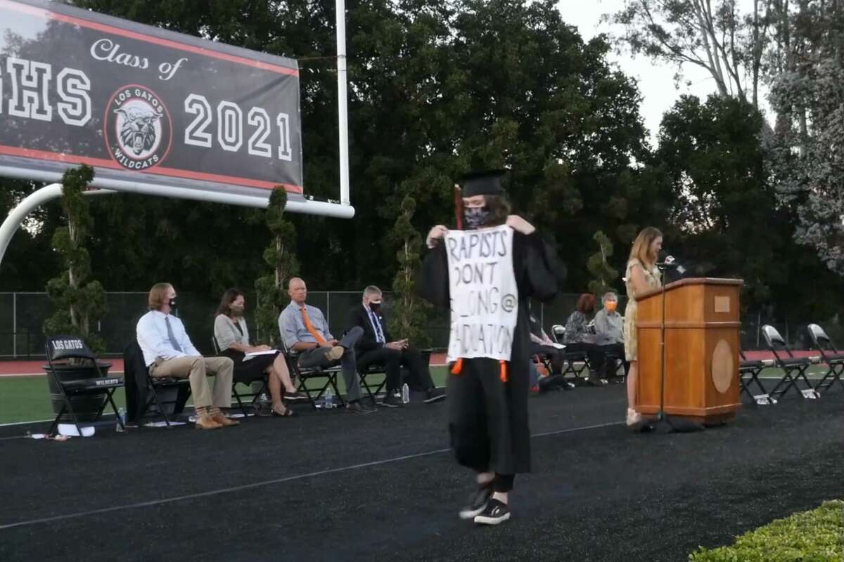 Sofia Rossi graduated from Los Gatos High School on June 4, 2021, carrying a sign reading "Rapists don't belong @ graduation."
