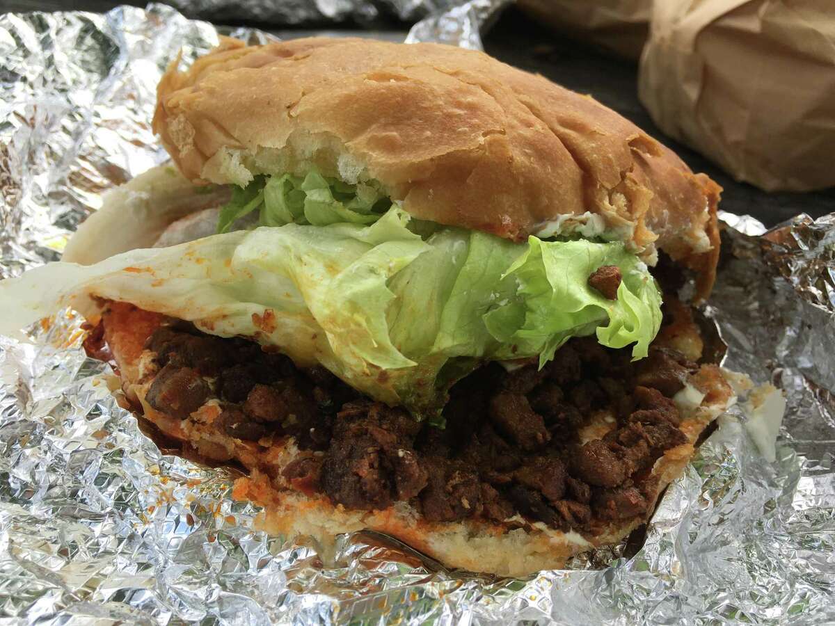 The al pastor torta at Benni's Tacos comes loaded with seasoned pork.