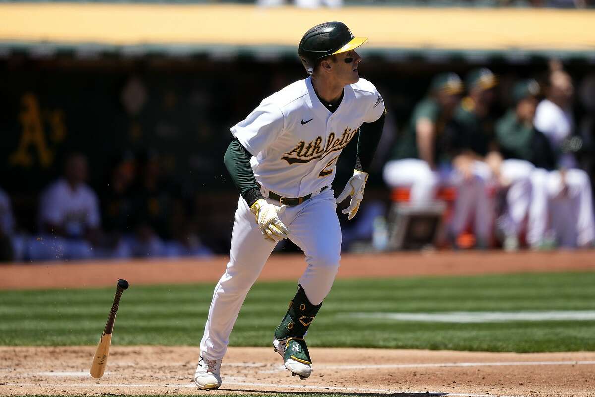 Oakland Athletics' Mark Canha hits a triple to drive in two runs against the Arizona Diamondbacks during the second inning of a baseball game Wednesday, June 9, 2021, in Oakland, Calif. (AP Photo/Tony Avelar)