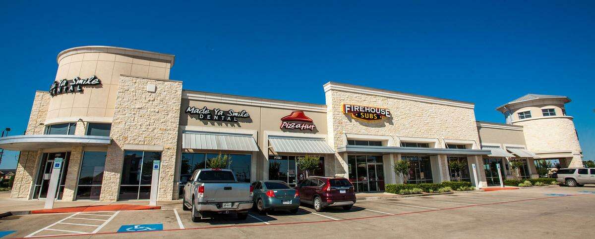 NewQuest Properties inked leases with Frost Bank and America's Best in phase two of Brazos Town Center in Rosenberg.