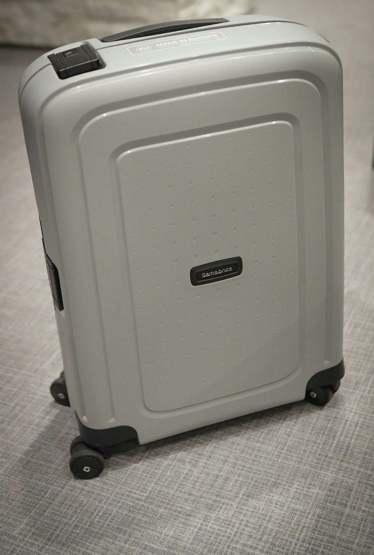 A Samsonite luggage made from recycled plastics is shown by Bob Patel, CEO of LyondellBasell chemical industry company Thursday, June 3, 2021, in Houston.