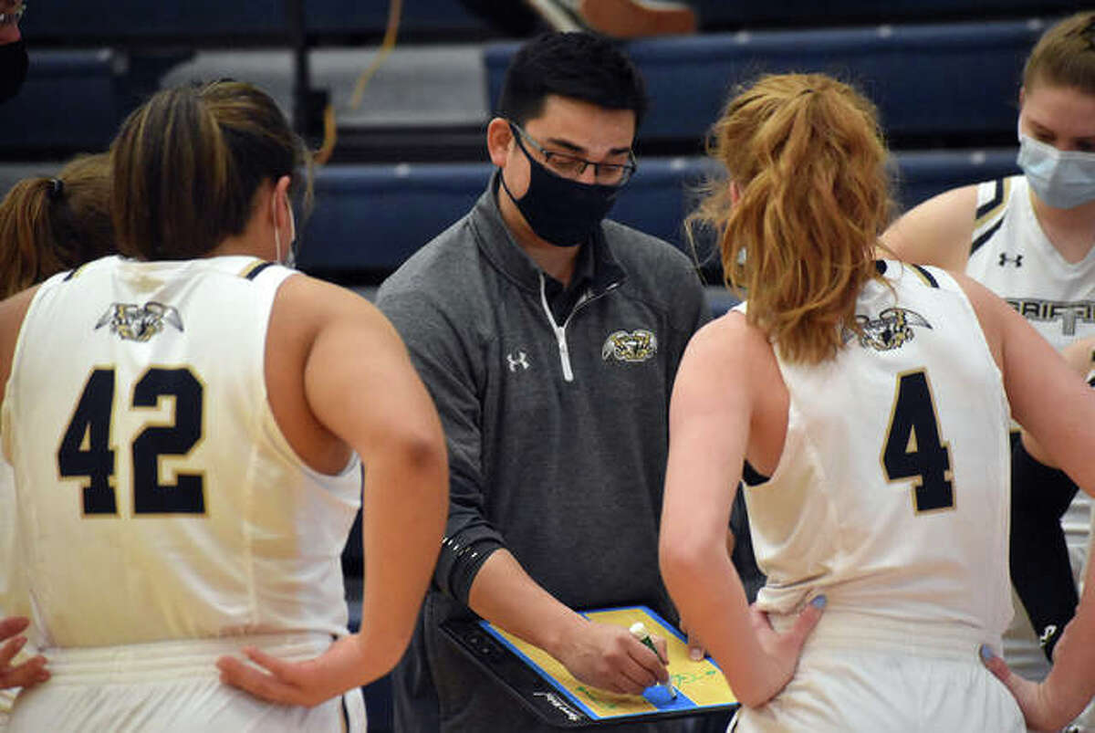 Father McGivney girls basketball coach Jeff Oller talks to his team during a timeout in a game last season.