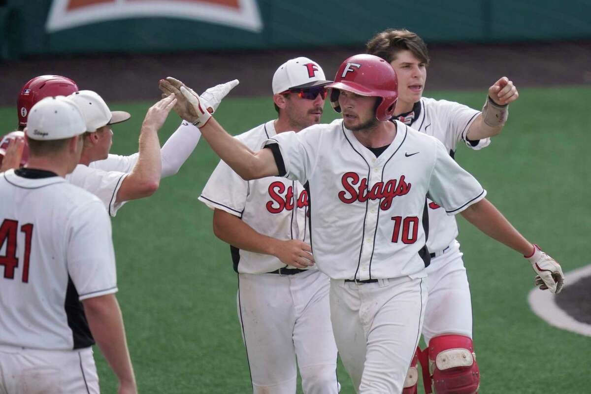 Fairfield's Dan Ryan (10) celebrates with teammates after scoring against Southern in the fourth inning of an NCAA college baseball tournament regional game Saturday, June 5, 2021, in Austin, Texas. (AP Photo/Eric Gay)