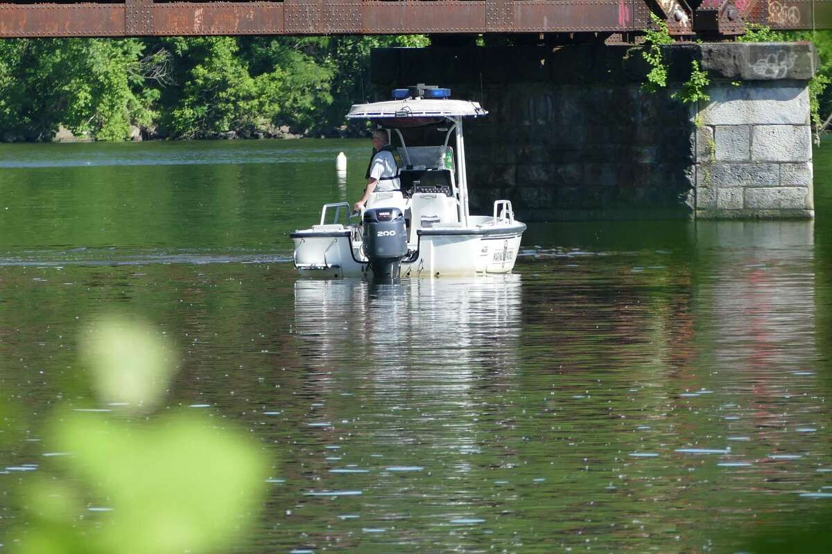 NEW MILFORD, Conn. — New Milford, Newtown and Brookfield authorities search the Housatonic just downstream of the Bleachery Dam Thursday, June 10, 2021 for two fishermen who went missing the night before.