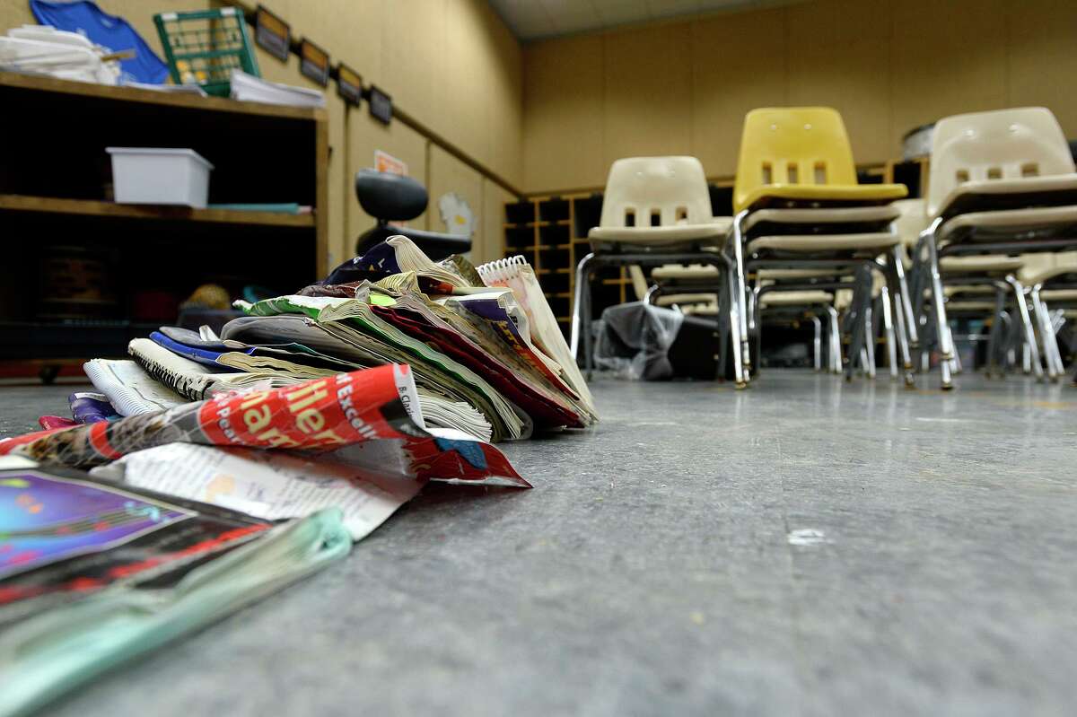 Damaged books dry in the band room at Vidor Middle School on Thursday. The school's fifth graders will go to class in a separate wing at Vidor High School, and the sixth graders will go to the junior high. Photo taken Thursday 9/14/17 Ryan Pelham/The Enterprise