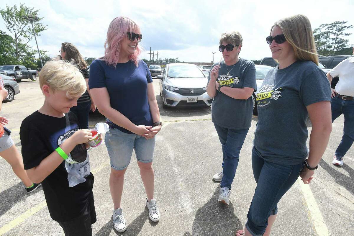 Sixth grade teachers Staci Glach (right) and Martha Scott talk with Marilee Johnson and her son Collin, who has spent his entire academic career learning in portables as they gather for a groundbreaking ceremony on the long-awaited new Vidor Middle School Thursday. Students and teachers have been working out of portables since the school flooded during Harvey in 2017. Photo made Thursday, June 10, 2021 Kim Brent/The Enterprise