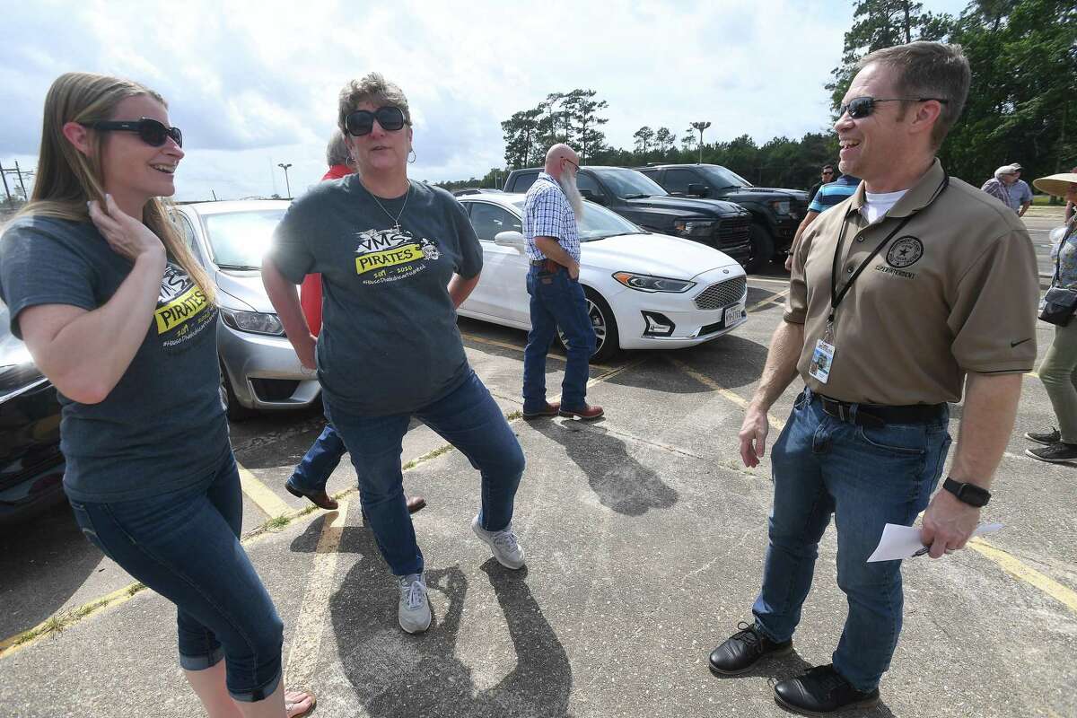 Sixth grade teachers Staci Glach (left) and Martha Scott talk with Vidor ISD Superintendent Jay Killgo as they gather for a groundbreaking ceremony on the long-awaited new Vidor Middle School Thursday.