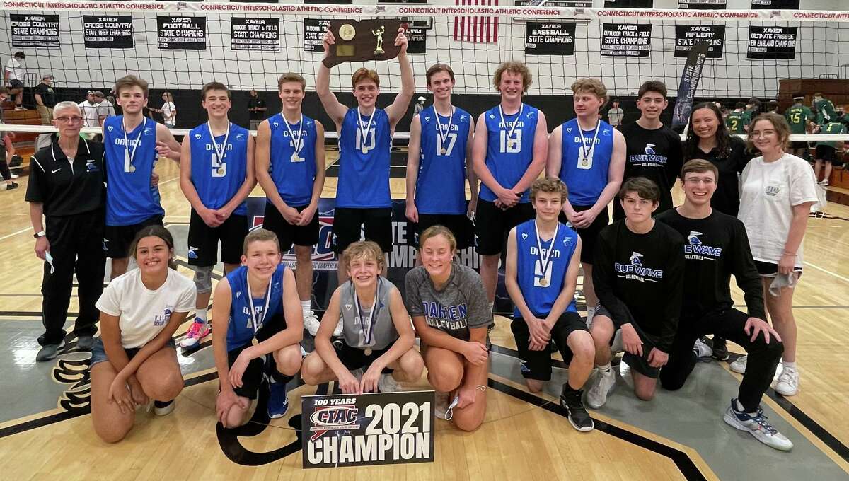 The Darien boys volleyball team celebrates after beating Enfield to win the CIAC Class L championship on Thursday in Middletown.