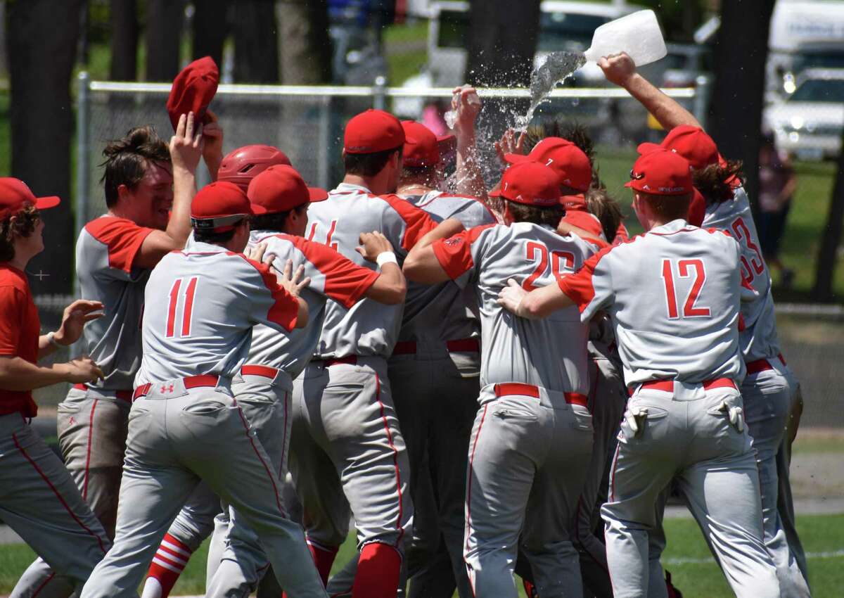 Northwestern celebrates beating Woodland, 3-2, in the Class M baseball semifinals at Muzzy Field, Bristol on Wednesday, June 9, 2021.
