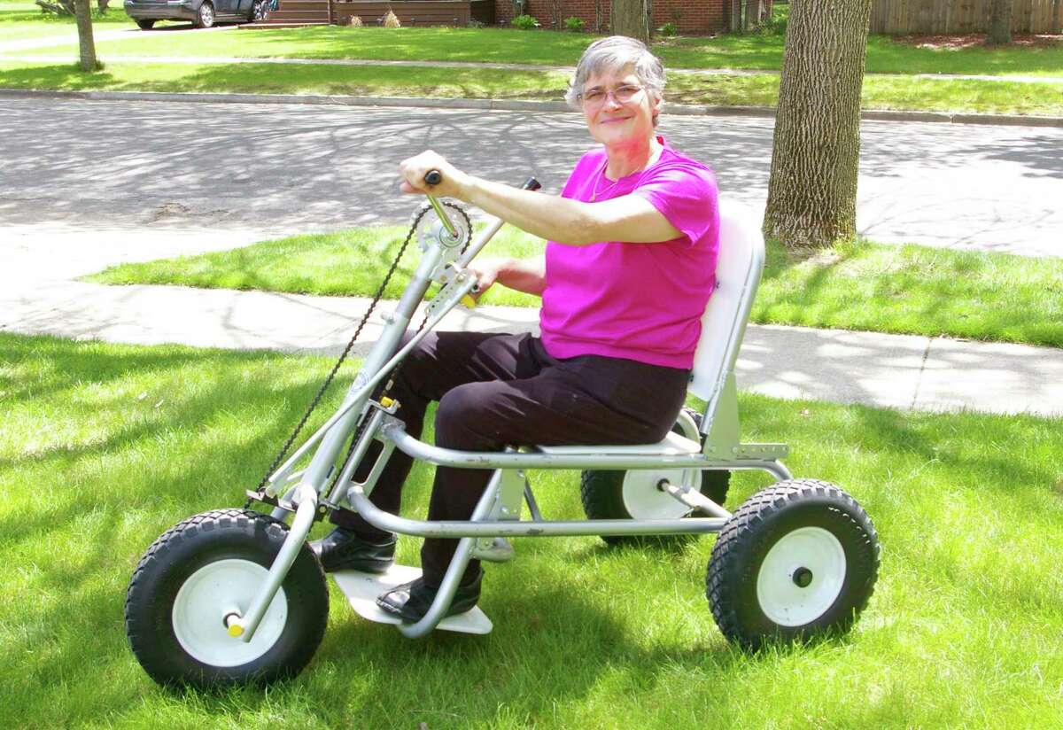 Alice Teisan started His Wheels International in 2005. The organization has provided bicycles and hand-pedaled trikes, like this one, to people in the U.S. and abroad. (Photo by Niky House/For the Daily News)