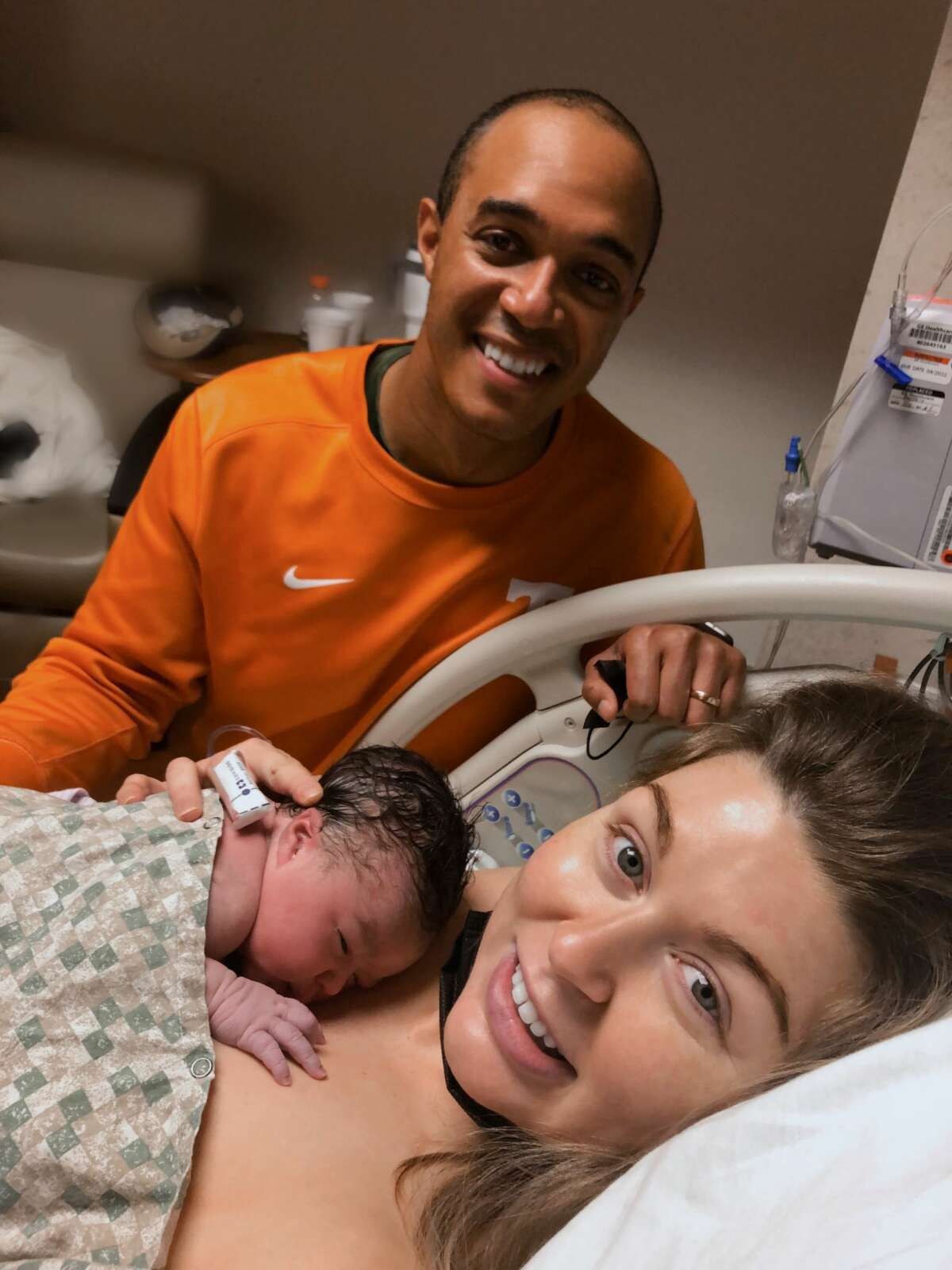 Aaron Wright with his wife Katie and their newly born daughter Olive. 