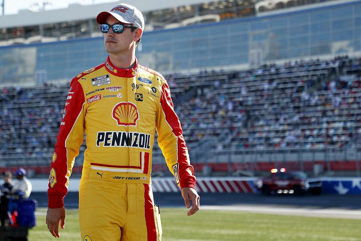 CONCORD, NORTH CAROLINA - MAY 30: Joey Logano, driver of the #22 Shell Pennzoil Ford, walks the grid prior to the NASCAR Cup Series Coca-Cola 600 at Charlotte Motor Speedway on May 30, 2021 in Concord, North Carolina. (Photo by Maddie Meyer/Getty Images)