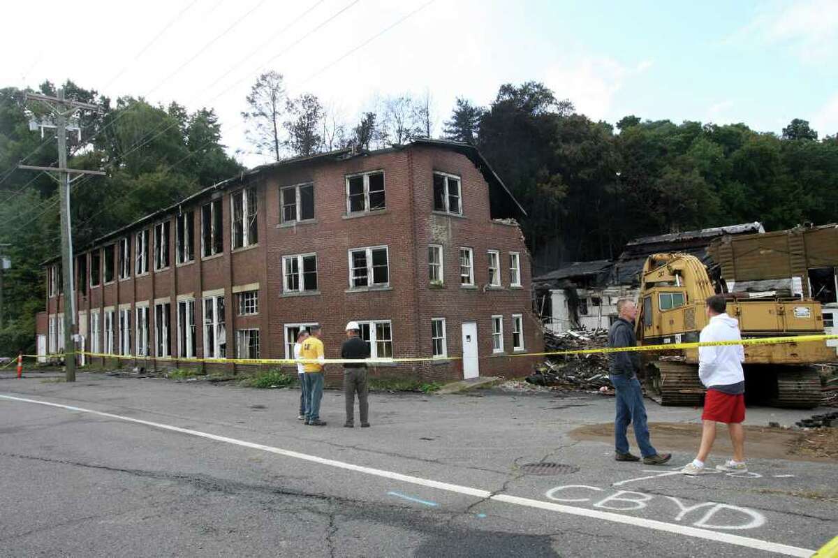 The Housatonic Wire Co., which suffered a fire on Saturday, awaits an engineer to determine the safety of the remaining structure on Monday, Sept. 13, 2010.