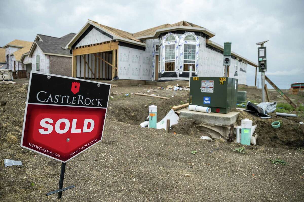 A "Sold" sign sits outside a home under construction in the CastleRock Communities Sunfield residential development in Buda, Texas, U.S., on Wednesday, May 15, 2021. Across the U.S., house prices are skyrocketing, bidding wars are the norm and supply is scarcer than ever. Now the market is too hot even for homebuilders. Photographer: Sergio Flores/Bloomberg