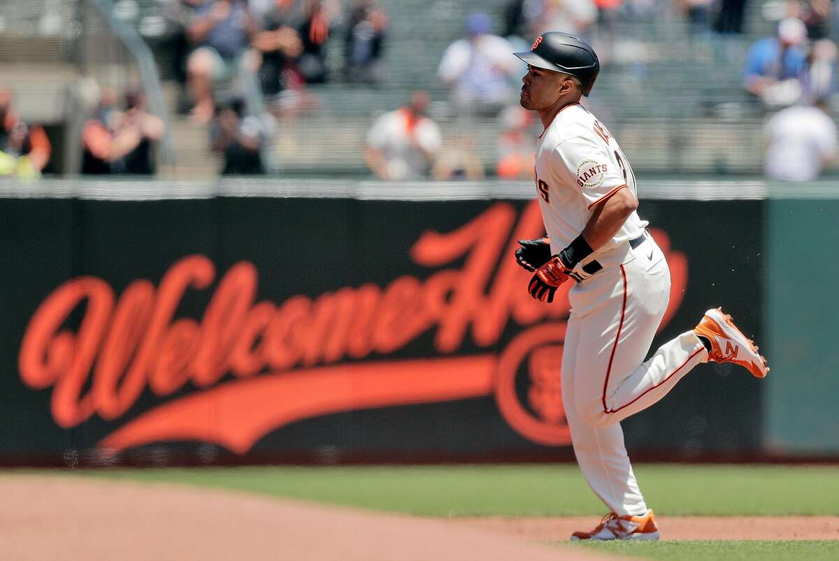 LaMonte Wade Jr. #31 of the San Francisco Giants smiling after