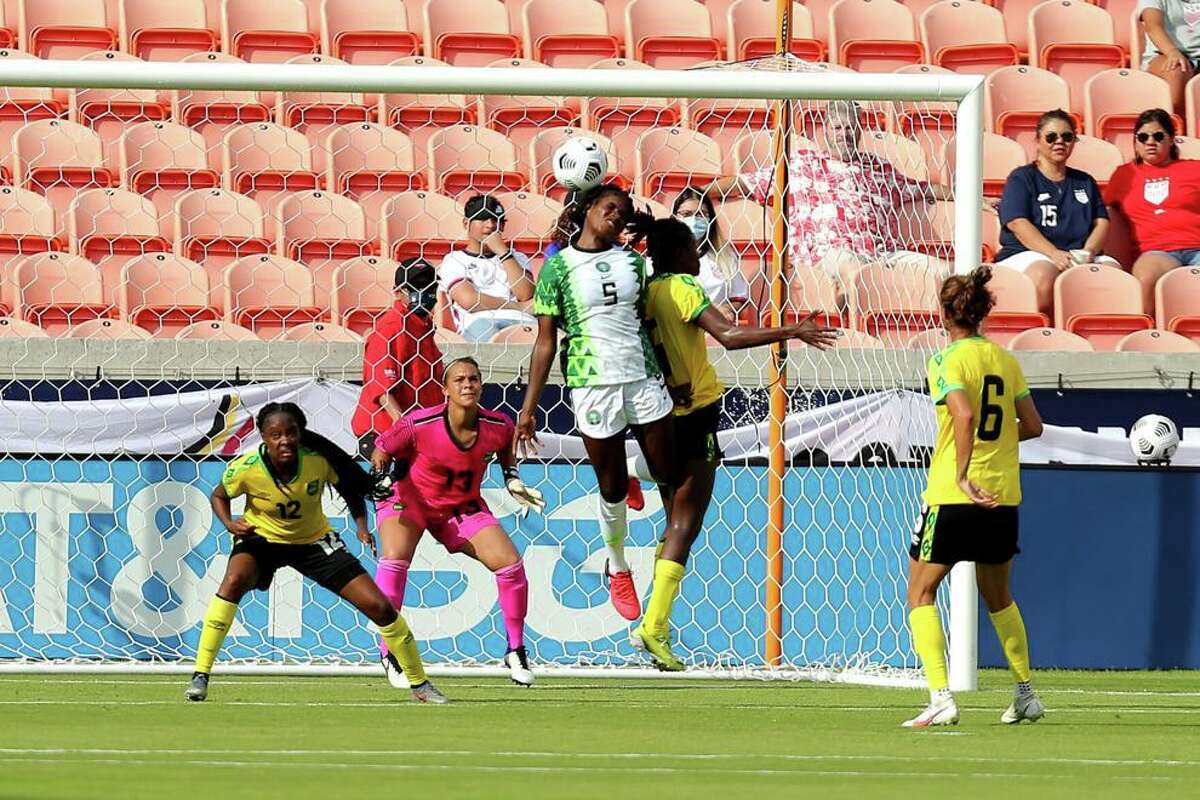 Nigeria's Ijeoma Okoronkwo (5) heads the ball upwards during the second half against Jamaica during a WNT Summer Series international friendly soccer match at BBVA Stadium in Houston.