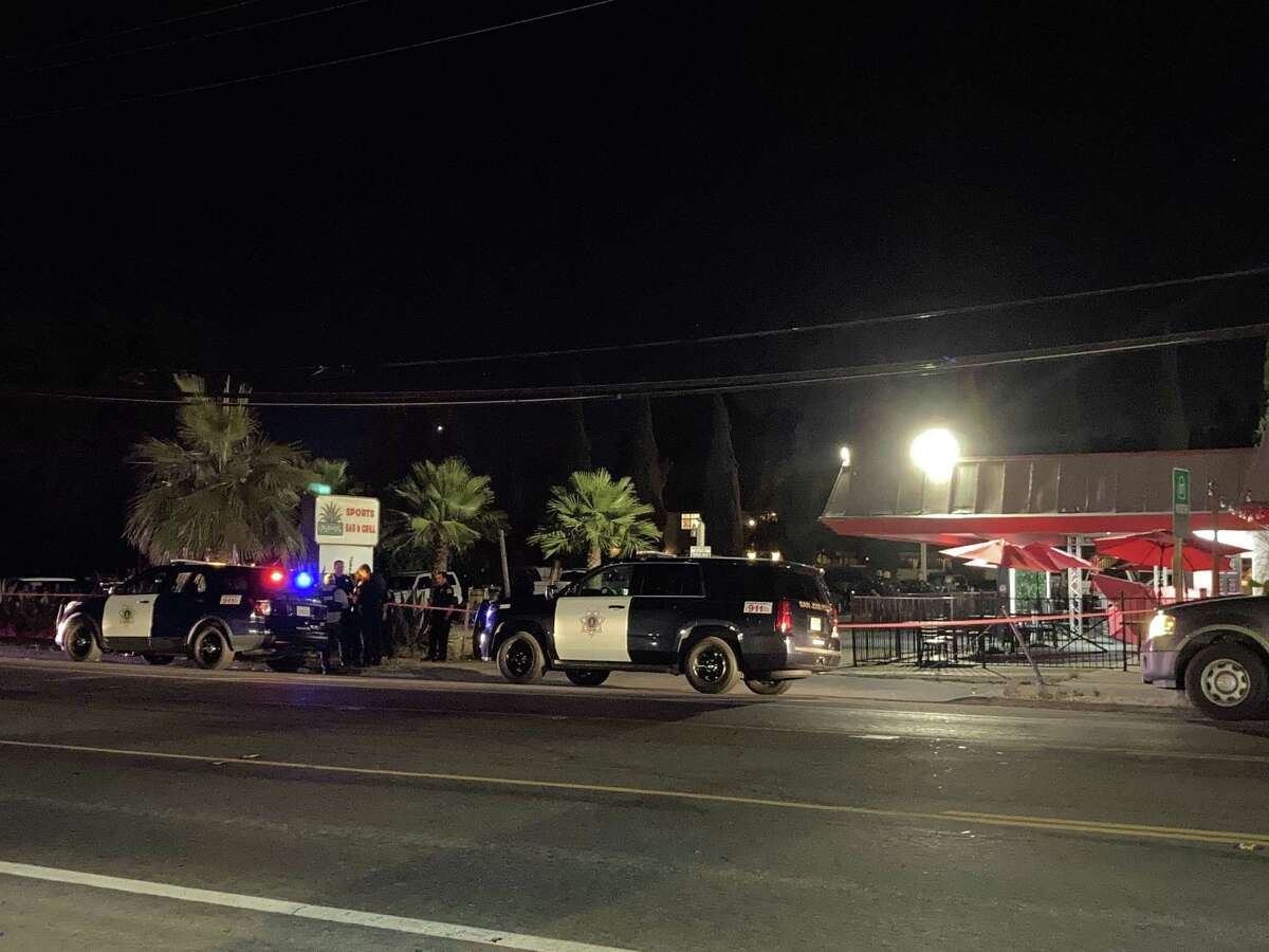 San Jose police investigate the scene of a fatal crash involving a suspected drunken driver at the outdoor dining area of the Agave Sports Bar.