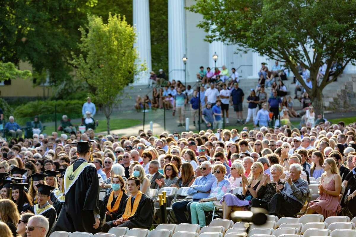 The graduating class of Daniel Hand High School gathered for commencement in person on Friday, June 11, 2021 in front of the Congregational Church in Madison. The in-person commencement ceremony marked a departure from the year before when most graduation ceremonies were held virtually due to the pandemic.