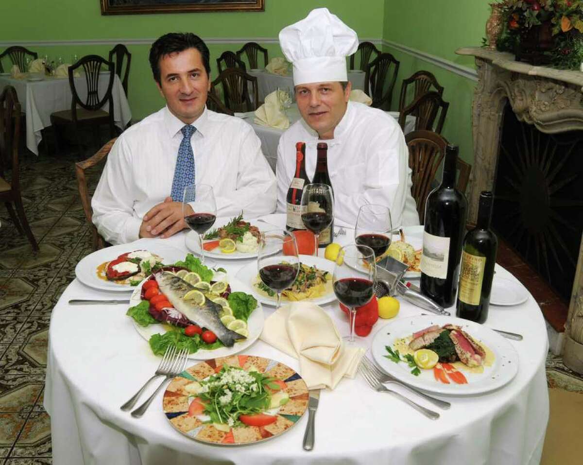 Left to right are manager Kenny Balidemaj and Deme Balidemaj, head chef at Castello Restaurant, in Danbury. The brothers are pictured with some of their gourmet dishes, on Thursday, August 26, 2010.