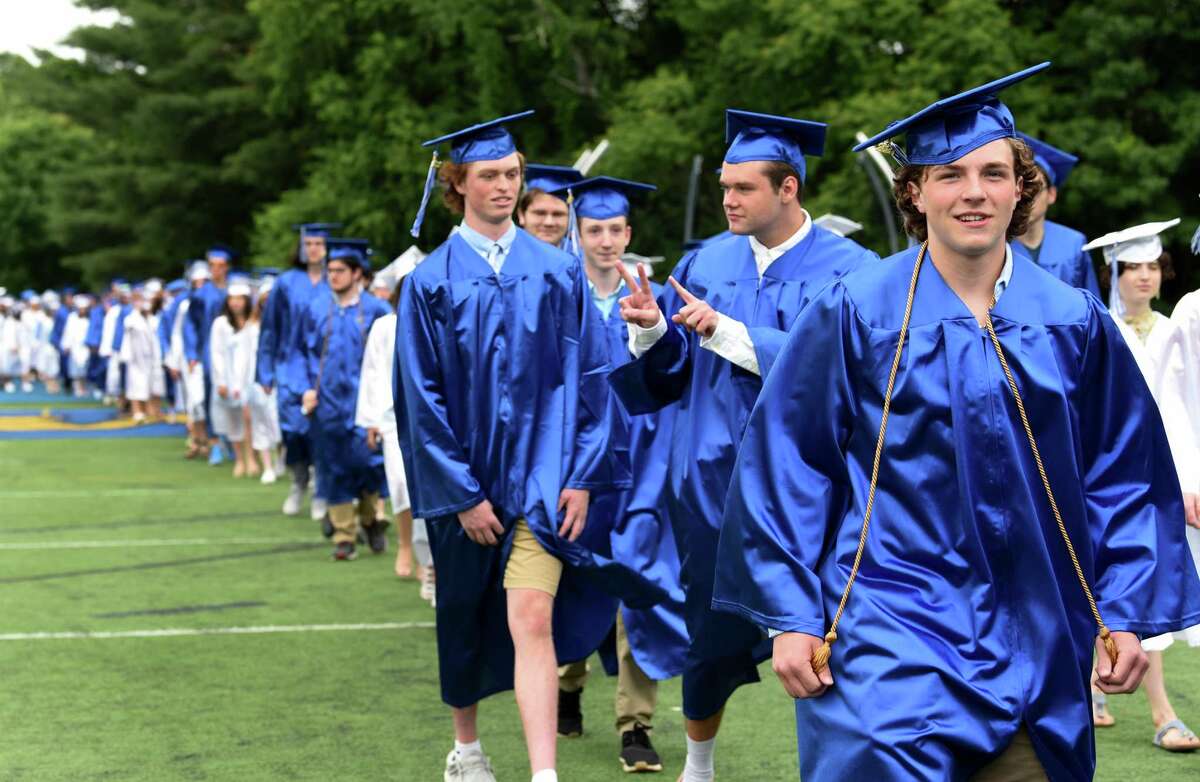 Graduates proceed onto the football field for Newtown High School commencement exercises Saturday, June 12, 2021.