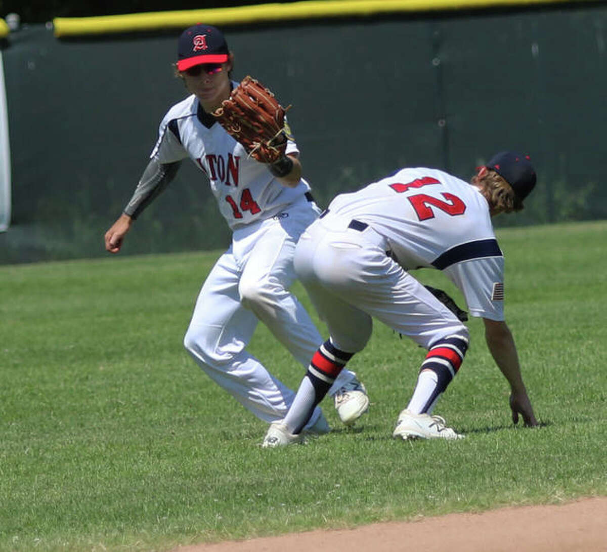 Alton’s Preston Schepers, left, went 4 for 4 at the plate with a double, two RBIs and two runs scored in a 10-6 loss to Belleville Saturday in Belleville. He is shown in action last season.
