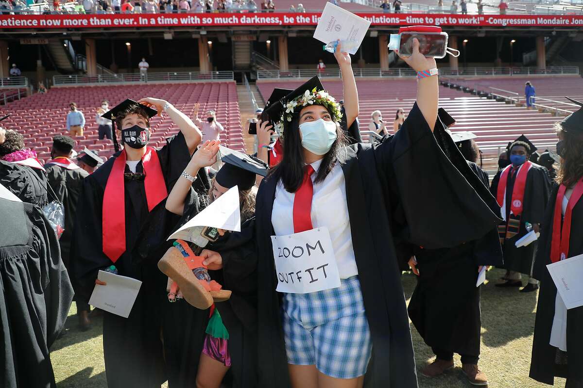 Students enter Stanford Stadium in a modified “Wacky Walk” during an undergraduate commencement ceremony at Stanford University on Sunday, June 13, 2021, in Stanford, Calif.