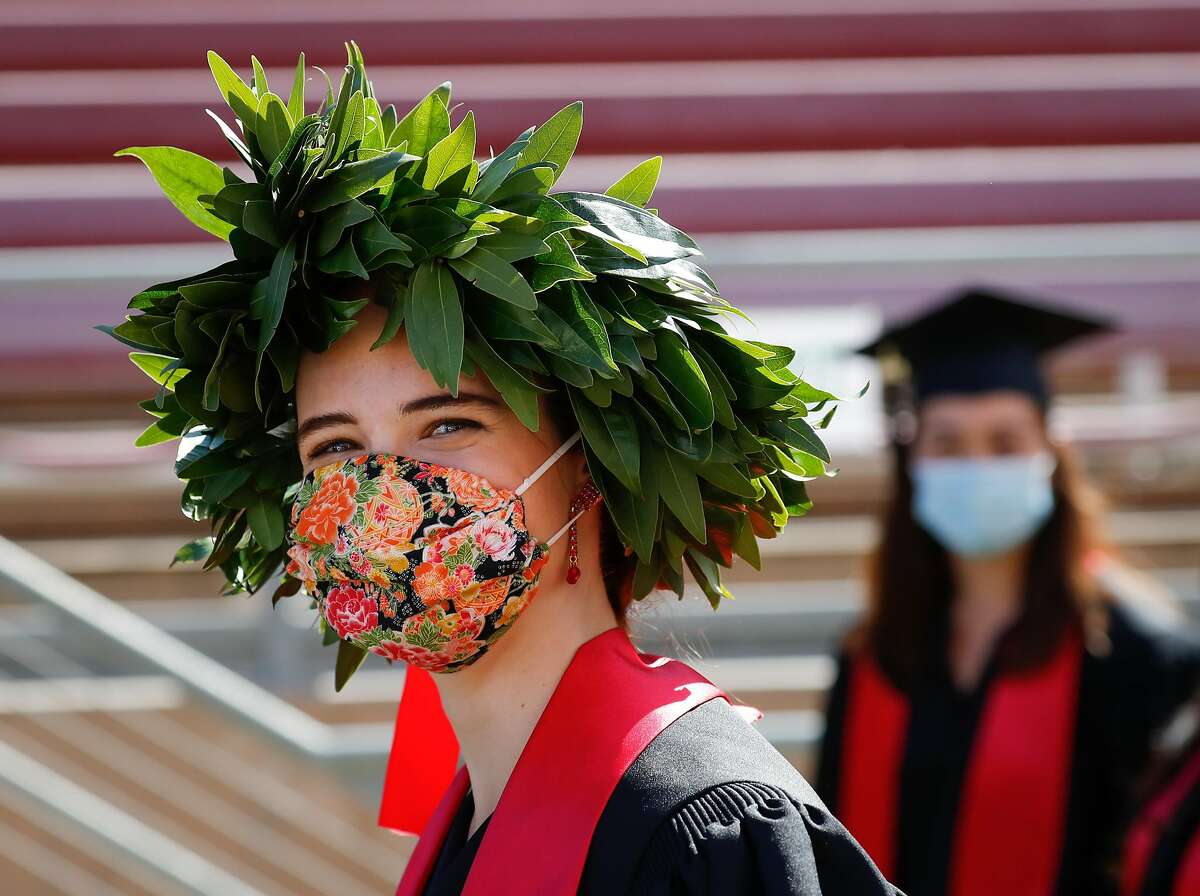 Students enter Stanford Stadium in a modified “Wacky Walk” during an undergraduate commencement ceremony at Stanford University on Sunday, June 13, 2021, in Stanford, Calif.