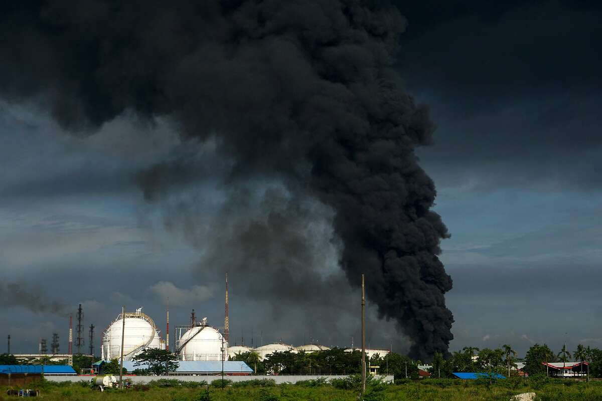 Smoke rises from a Pertamina oil company depot in Cilacap, Indonesia, in 2021 after a fire was extinguished at the plant.