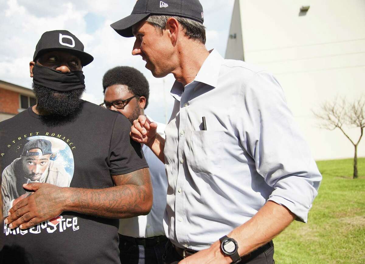Rapper Trae tha Truth, left, talks to Beto O’Rourke before addressing attendees of a Powered By People rally at Finnigan Park in Houston’s Fifth Ward on Sunday, June 13, 2021. The tour was hitting multiple counties in Texas to drum up support for voting rights.