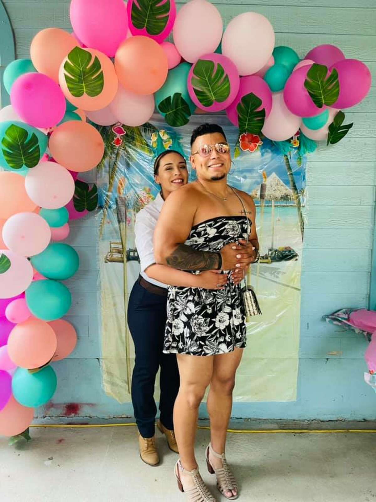 Alexis Collins and Jordan Santos stole the show at a "Dress Like Your Spouse" party hosted by their family that has now gone viral on Facebook. 