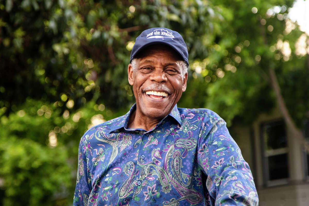 Danny Glover takes a moment for a few photos after filming the commercial 