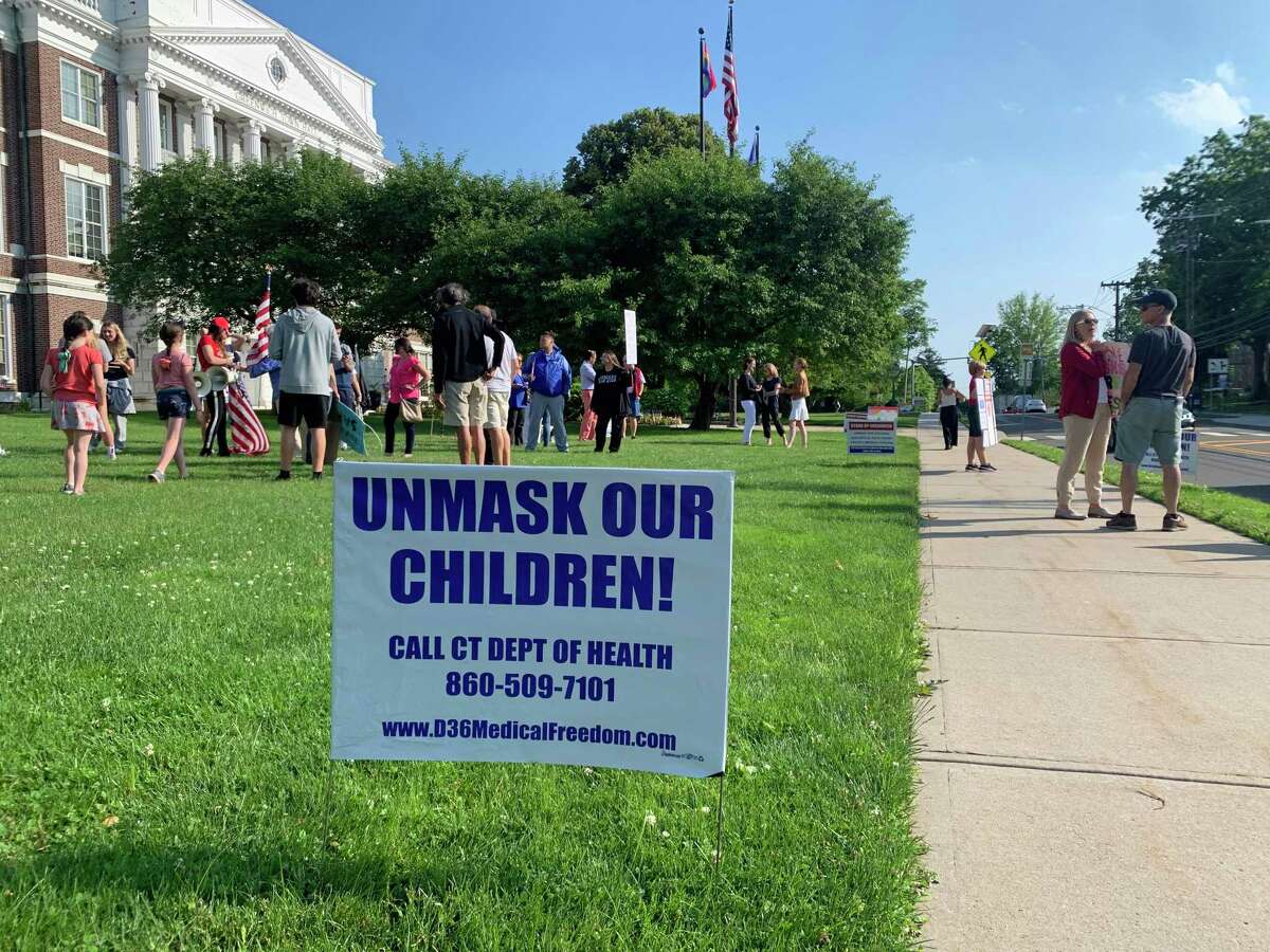 An "Unmask our children" sign at a "Flag Day Rally," organized by a group called the Greenwich Patriots at Greenwich Town Hall, June 14, 2021, in Greenwich, Conn. The Greenwich Patriots called the gathering to protest the masking and vaccination of students, as well as the alleged teaching of critical race theory in schools.
