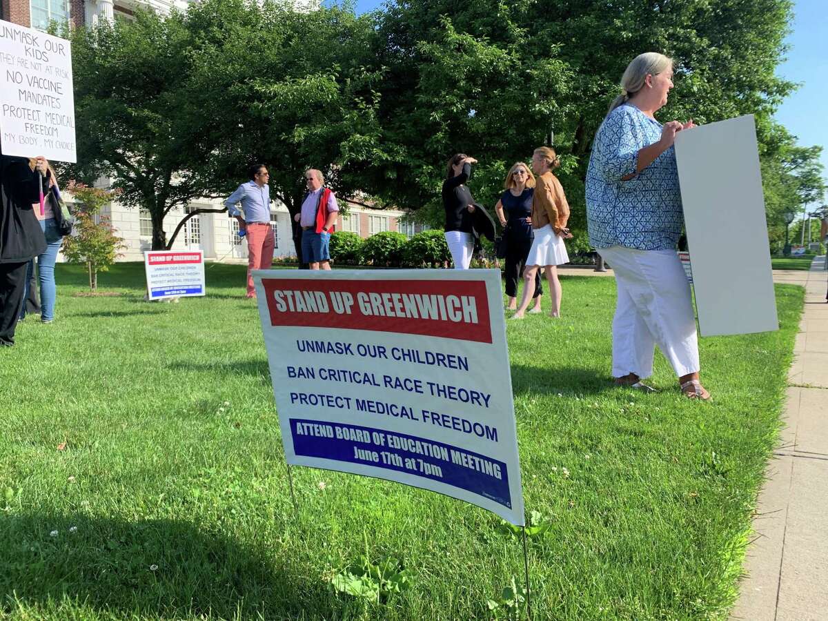 A "Stand Up Greenwich" sign at the June 14, 2021 "Flag Day Rally" at Greenwich Town Hall, in Greenwich, Conn. The rally was organized by the Greenwich Patriots, who are protesting the masking and vaccination of students, as well as the alleged teaching of critical race theory.