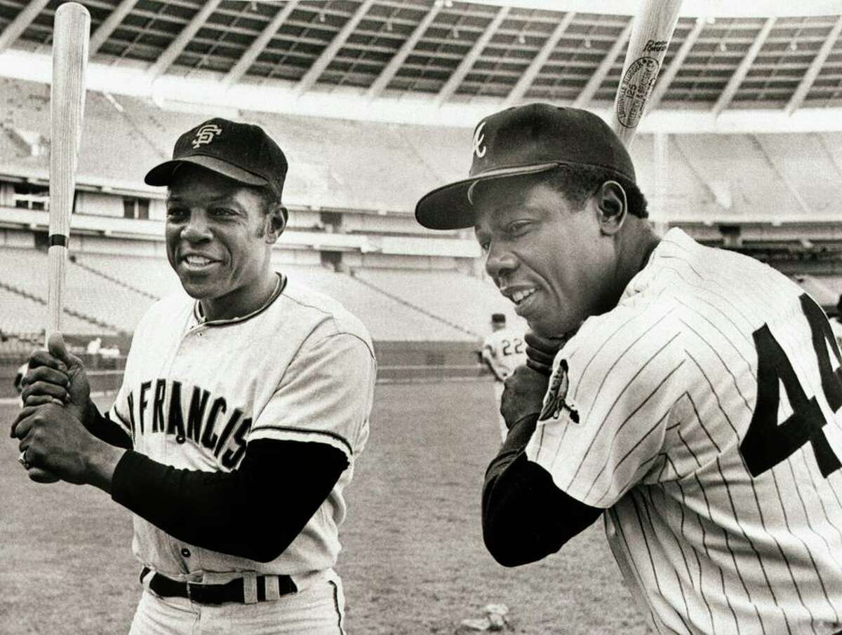 Recognized Negro League stats add 10 hits to Willie Mays’ total, but he doesn’t get closer to Hank Aaron (right) in HRs.