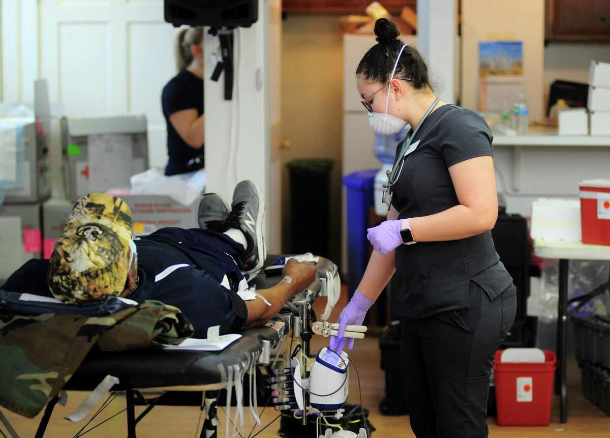 Collection Technician Jayla Ramos prepares donated blood during a American Red Cross blood drive at Whitneyville Cultural Commons in Hamden, Conn., on Friday Apr. 3, 2020.