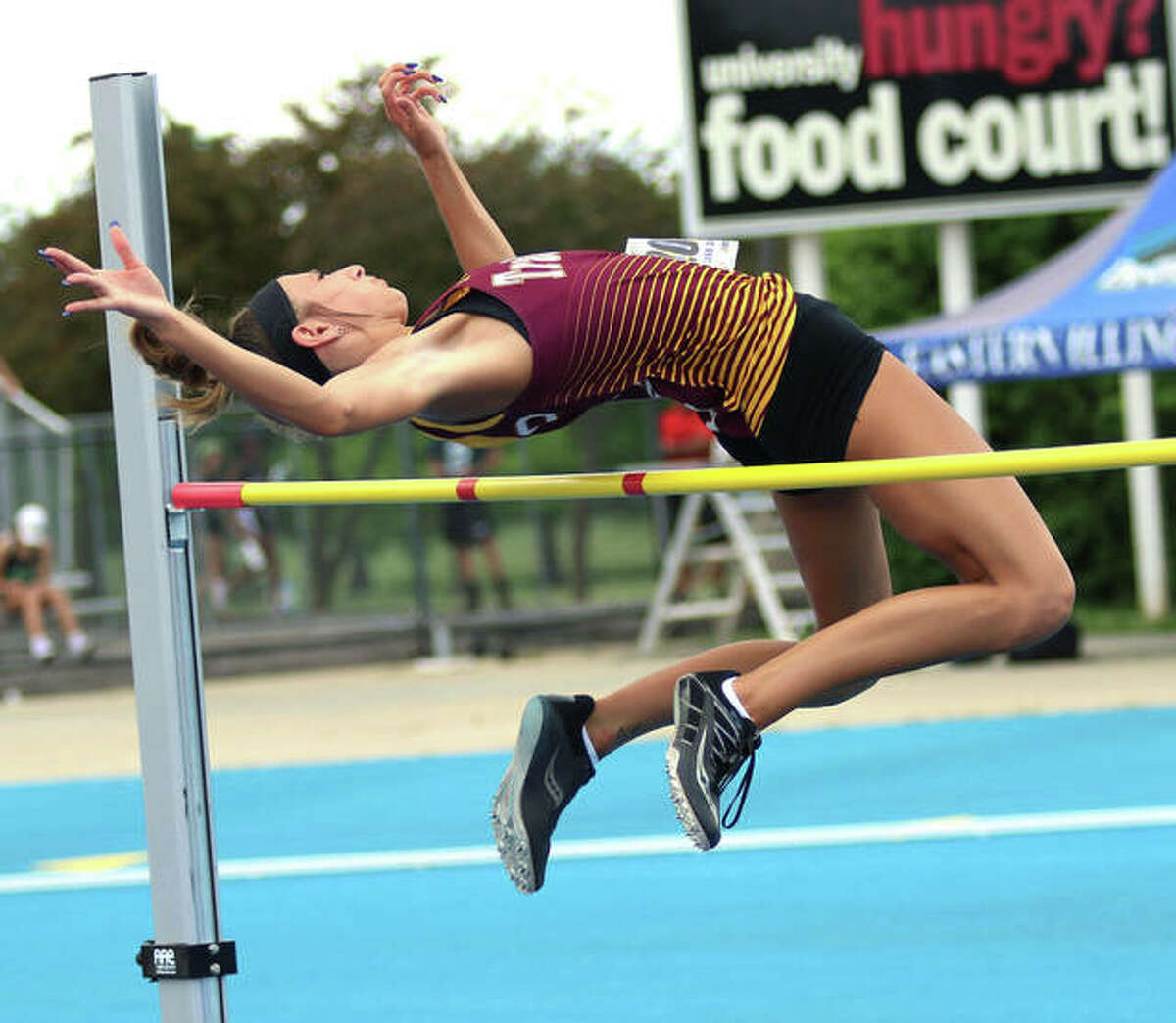 EA-WR senior Hannah Sechrest gets over the bar at 5 feet, 2 inches in the high jump at the Class 2A state meet Friday at O’Brien Stadium in Charleston. Sechrest finished seventh in the event, adding the the eighth-place state medal she won as a sophomore.