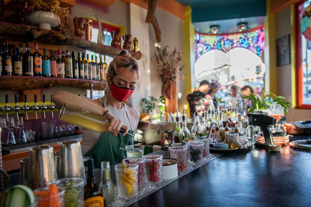 Natalie Lichtman makes drinks for customers at Red Window, Saturday, June 12, 2021, in San Francisco, Calif. The restaurant is located at 500 Columbus Ave.