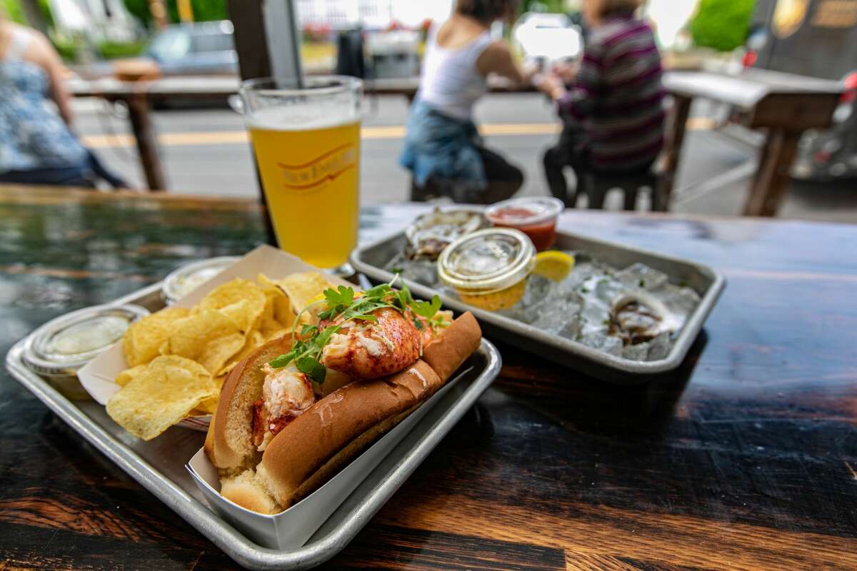 A hot Lobster Roll and Copps Island Oysters at Knot Norm's in Norwalk, Conn., on June 2, 2021.